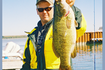 a man holding a fish