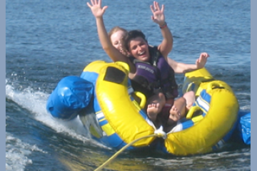 a group of people on a raft in a body of water