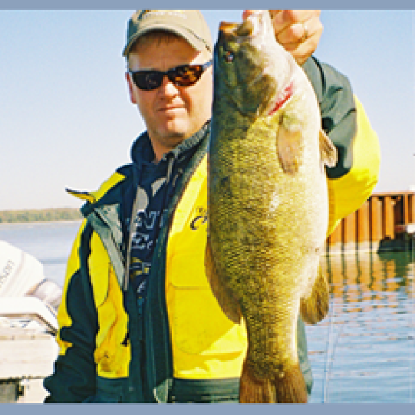 a man holding a fish