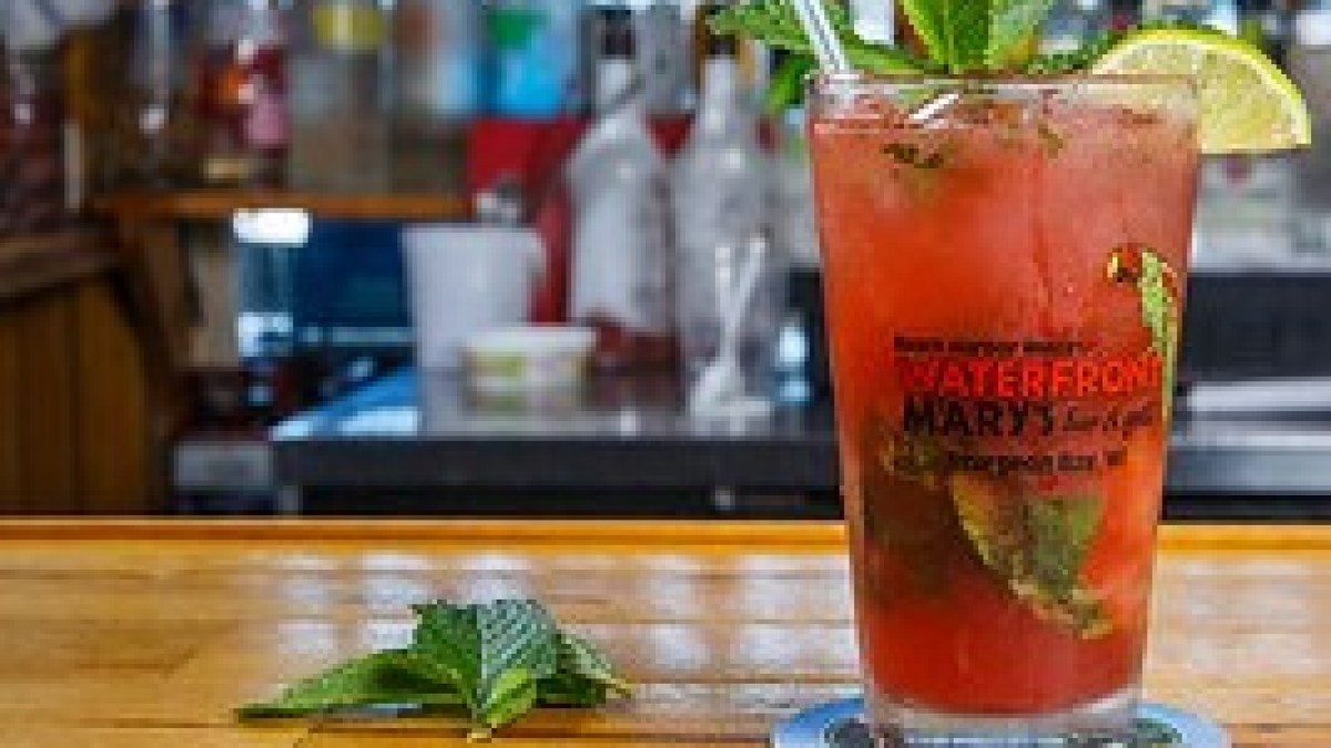 a close up of a glass of beer on a table