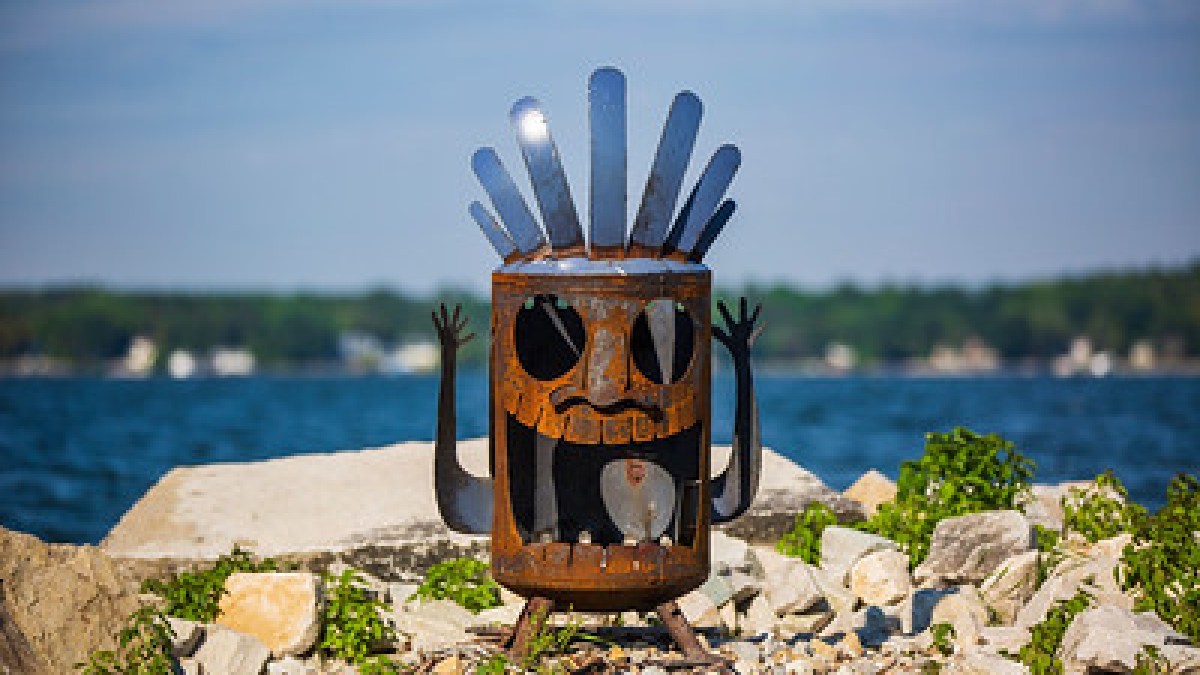 a close up of a rock near the ocean